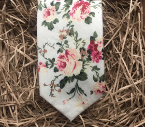 A pink floral men's tie on an ivory background. The set make a perfect men's gift and is handmade at the Daisy and Oak Studio, UK