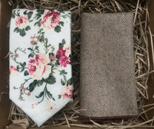 Load image into Gallery viewer, A blush pink floral men&#39;s tie on an ivory background. The tie is matched with a beige wool pocket square. The set comes stunningly gift wrapped and is perfet as a men&#39;s gift, wedding tie or groomsmen gift. At Daisy and Oak Studio, we make our ties by hand and offer bespoke products.