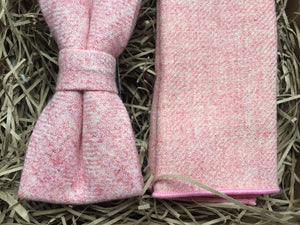 A close up photo of a blush pink wool bow tie and pocket square by Daisy and Oak Studio. The bow tie and pocket square come beautifully gift wrapped and is the perfect wedding tie, grooms or groomsman gift.