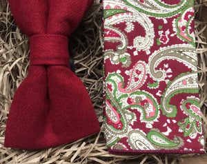 A deep red men's wool bow tie and paisley red pocket square by Daisy and Oak Studio. The set makes a stunning men's gift for Christmas or secret Santa. 