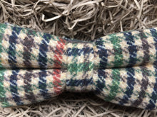 Load image into Gallery viewer, A close up shot of a houndstooth check men&#39;s bow tie in wool. THe checks are in a burnt orange, green, brown and navy colour. The bow tie comes gift wrapped and is perfect as men&#39;s gift or secret Santa. It is also often used as a groomsmen gift or grooms bow tie paired with a tweed suit.