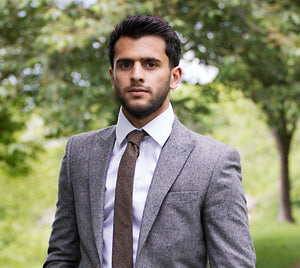 A brown check wool men's tie, camel brown pocket square and floral pocket square. THis set offers a fabulous vintage look and is extremely popular. The set is handmade at the Daisy and Oak Studio.