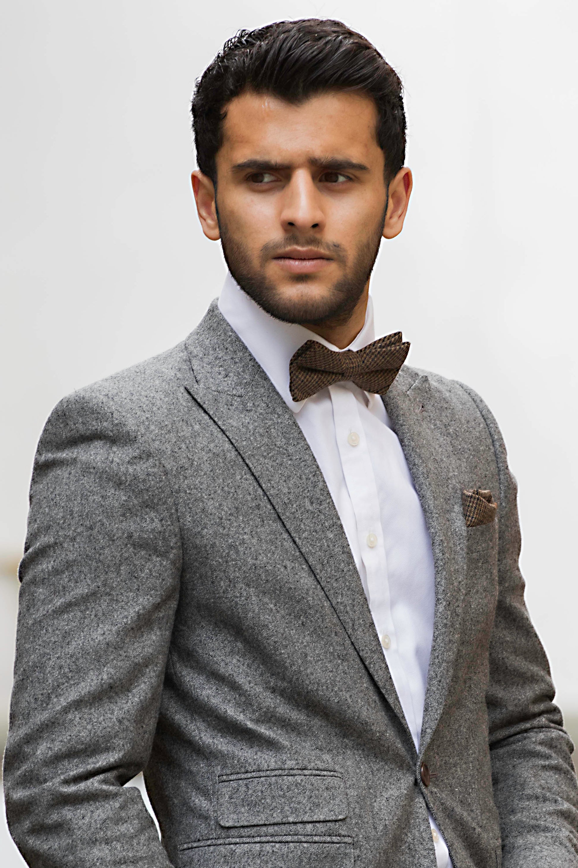 A brown check bow tie in wool matched with a burgundy red wool pocket square. The tie set comes with free gift wrapping and is handmade in the Daisy and Oak Studio, UK
