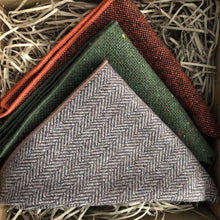 Load image into Gallery viewer, A set of three men&#39;s wood pocket square handkerchiefs in rust, burnt orange, brown herringbone and moss green. The set comes with free gift wrapping and is an ideal men&#39;s gift, groomsmen gift or to be used as wedding attire.