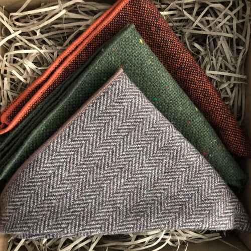 A set of three men's wood pocket square handkerchiefs in rust, burnt orange, brown herringbone and moss green. The set comes with free gift wrapping and is an ideal men's gift, groomsmen gift or to be used as wedding attire.
