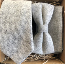 Load image into Gallery viewer, A light grey wool herringbone mens tie bow tie and pocket square set. This is perfect as a mens Christmas gift or secret Santa as it is beautifully gift wrapped. Gift wrapping is free.