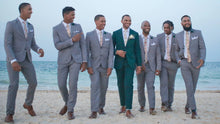 Load image into Gallery viewer, Groomsmen on a beach wearing a blush pink floral men&#39;s tie and beige braces. Daisy and Oak Studio makes bespoke men&#39;s ties, bow ties and pocket squares. All of our products are gift wrapped and make perfect men&#39;s gifts at Christmas and birthdays.