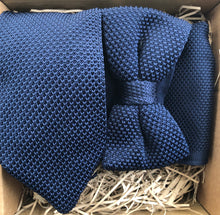 Load image into Gallery viewer, A photo of a navy knitted necktie, bow tie and pocket square. The tie set is perfect wedding attire or as a man&#39;s gift and comes with free gift wrapping. Made by Daisy and Oak Studios.