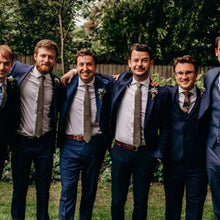 Load image into Gallery viewer, Groomsmen wearing a sage green men&#39;s tie, bow tie and pocket square made in cotton and ideal as a wedding tie. The ties are handmade by Daisy and Oak Studio and come with free shipping and gift wrap so making an ideal groomsmen gift or mens gift.
