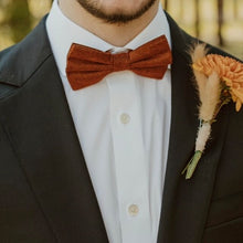 Load image into Gallery viewer, A  rust coloured, burnt orange men&#39;s bow tie. This. bow tie makes an ideal gift for men, groomsmen, Christmas gift as it comes with beautiful free gift wrapping. The ties ar handmade and are shipped for free to the UK and USA from Daisy and Oak Studio