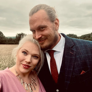 A groom wearing a burnt orange skinny necktie ideally matching the brides dress. The rust ties is handmade and comes beautifully gift wrapped so is perfect as a men's Christmas gift or groomsmen presents.