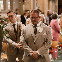 Load image into Gallery viewer, A groom wearing a green knitted tie at a wedding. Our ties are handmade and perfect gifts for men.. They come with free gift wrapping and are made by Daisy and Oak Studio.