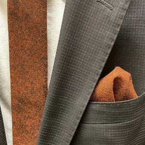 Groomsmen wearing a burnt orange tie with brown cords to match the wedding dress. The rust tie is beautifully wrapped and ideal for wedding gifts, men's gifts and Christmas gifts.
