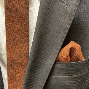 Groomsmen wearing a burnt orange tie with brown cords to match the wedding dress. The rust tie is beautifully wrapped and ideal for wedding gifts, men's gifts and Christmas gifts.