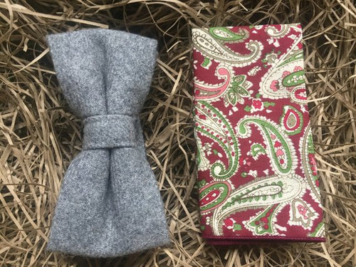 A grey wool bow tie and paisley red pocket sqaure. Gift wrapped to make the ideal men's Christmas gift.