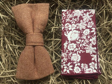 Load image into Gallery viewer, A camel brown men&#39;s bow tie and floral pocket square. The floral pocket square is red with white flowers and together they make a perfect men&#39;s gift or wedding bow tie set.