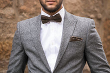 Load image into Gallery viewer, A brown check bow tie in wool matched with a burgundy red wool pocket square. The tie set comes with free gift wrapping and is handmade in the Daisy and Oak Studio, UK